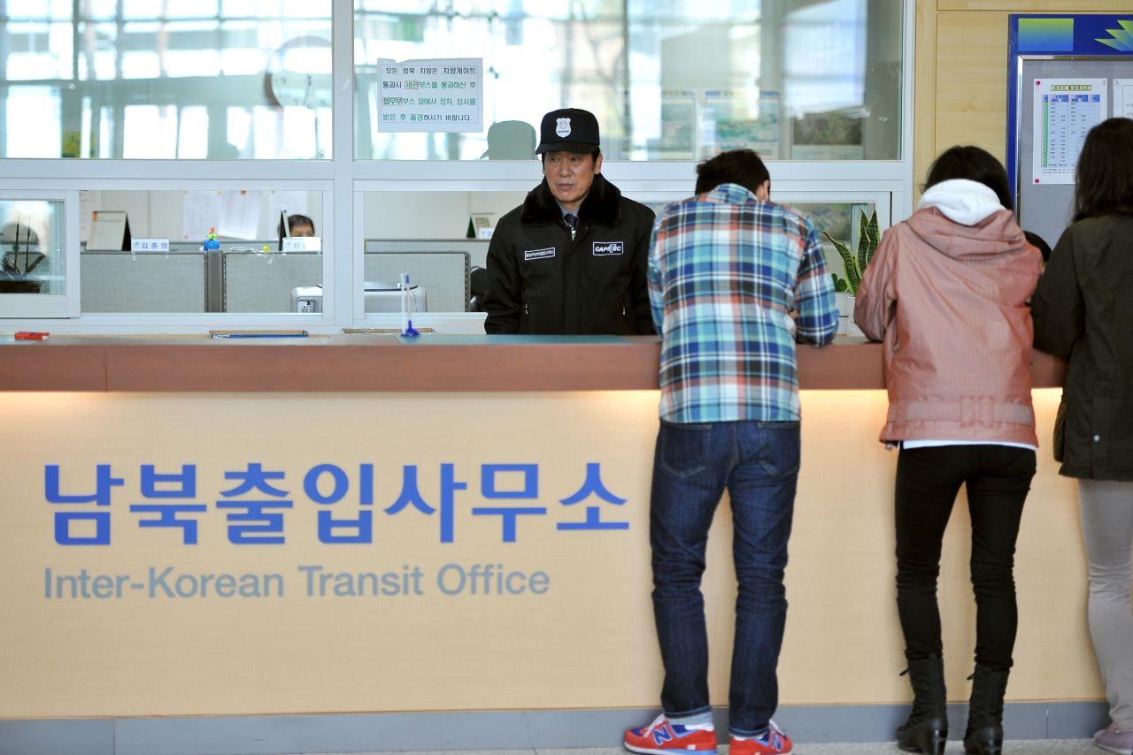 South Koreans stand in front of an information desk at the Inter-Korean Transit Office in Paju after being blocked from North Korea in April.