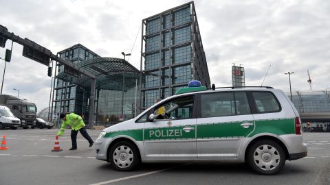 A police officer closes off the entrance to the Hauptbahnhof, the central rail station, on April 3. A bomb disposal team checking out a construction site near the station discovered the bomb, and roads were closed overnight.