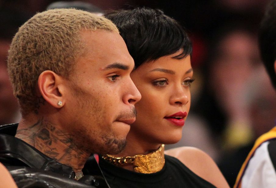 Chris Brown, shown here with Rihanna in December 2012, took heat when he debuted a <a href="http://marquee.blogs.cnn.com/2012/09/11/chris-browns-rep-on-his-tatoo-its-not-rihanna/" target="_blank">tattoo on his neck</a> that some people thought resembled a battered woman's face. "His tattoo is a sugar skull (associated with the Mexican celebration of the Day of the Dead) and a MAC cosmetics design he saw," his rep said in a statement. "It is not Rihanna or an abused woman as erroneously reported."