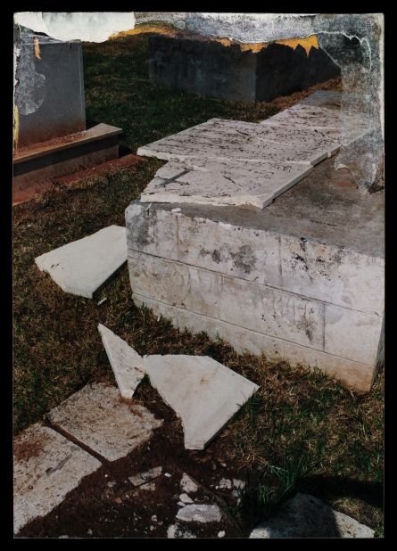 A damaged grave in a Christian cemetery in the town of Lod, Israel, depicted by Dor Guez. Guez says the city has been home to a Christian community since the 4th century, but after the town was claimed by Israel in 1948, all but about 1,000 Palestinians were expelled.