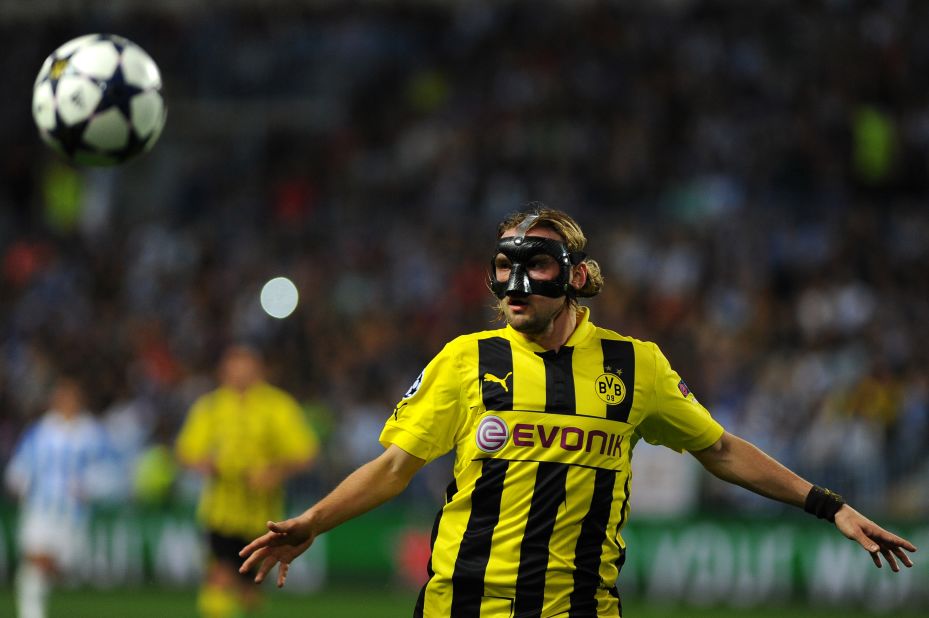 Marcel Schmelzer started in defense for Dortmund despite being forced to wear a mask after breaking his nose at the weekend.
