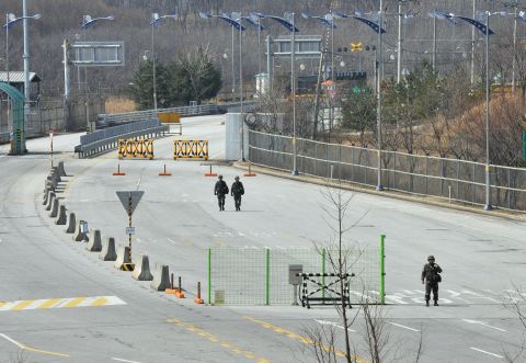 South Korean soldiers walk down the empty road after trucks were denied access to the Kaesong joint industrial park in North Korea in April as tensions flared.