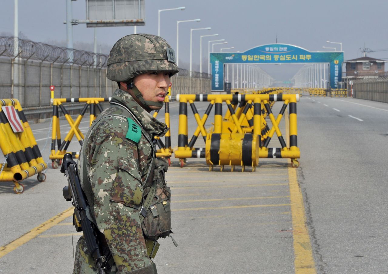 A South Korean soldier stands on a road linked to North Korea at a military checkpoint in Paju on Wednesday, April 3. North Korea has asked for talks to reopen the industrial complex, which is an important symbol of cooperation between the two countries.