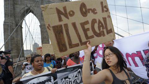 Protesters march across New York's Brooklyn Bridge in July 2010 seeking the repeal of an Arizona immigration law.