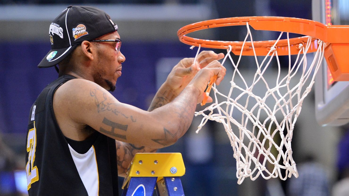 Wichita State's Carl Hall cuts down the net at Los Angeles' Staples Center after an upset win over Ohio State. 