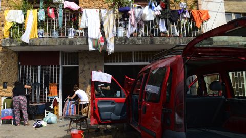 People affected by the storm and resulting floods in La Plata put clothes and other belongings out in the sun to dry on April 4. Rescuers were still searching for missing people.