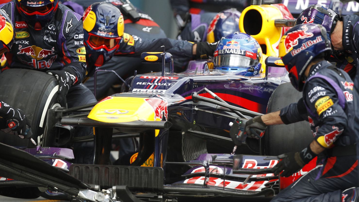 The Red Bull pit crew, pictured here working on Sebastian Vettel's car, set the record in Malaysia.