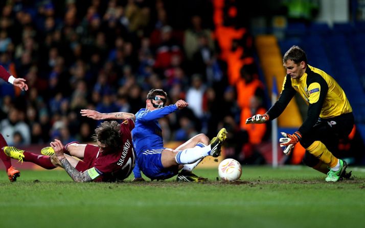 Fernando Torres, wearing his protective mask,  fired Chelsea ahead after 16 minutes against Rubin Kazan as the home side took control of the first leg at Stamford Bridge. Victor Moses then added a second 16 minutes later.