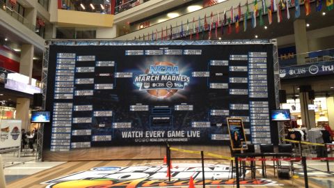 A giant March Madness bracket lives in the CNN Center atrium to remind visitors that they've absolutely lost their office pool.