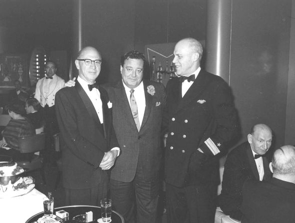 Entertainer Jackie Gleason, center, hangs out aboard the SS United States in this undated photo.