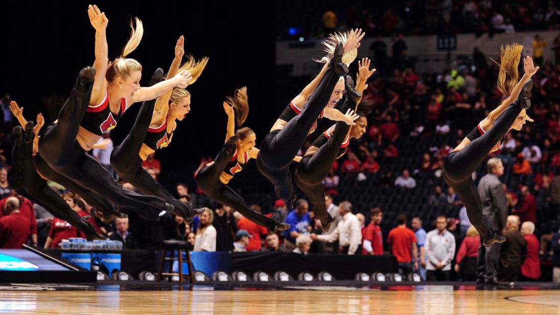 Louisville Cardinals cheerleaders perform during a game against the Duke Blue Devils on March 31 in Indianapolis. Click through to see more NCAA cheerleaders jumping and tumbling through March Madness.