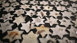  detail from an installation by Ceramic artist Chava Rosenzweig of ceramic stars representing how the Holocaust shaped people's lives, on January 15, 2013 in Manchester, England. The installation has been created to mark Holocaust Memorial Day on Sunday 27 January 2013. The piece is made up of gas fired ceramic stars and is intended to make viewers think about the how the Holocaust has shaped the lives of generations. The yellow star, based on the Star of David, was a symbol of pride for Jewish people turned into a symbol of humiliation by the Nazis. The work was inspired by Chava Rosenzweig's grandmother who was in Auschwitz and whose job as seamstress was to make the yellow stars which Jewish people were forced to wear by the Nazis. 