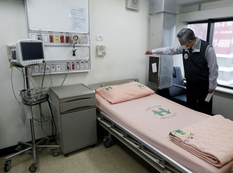 Taiwan's Health Minister Chiu Wen-ta checks the negative pressure system in a isolation room as he inspects preparations for the virus in Taipei City Hospital Heping Branch, on April 6.