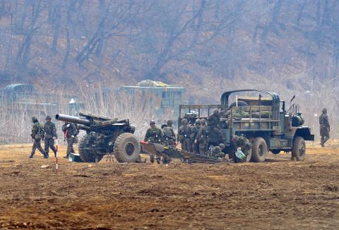 South Korean soldiers man a cannon at a military training field in Paju on April 5.