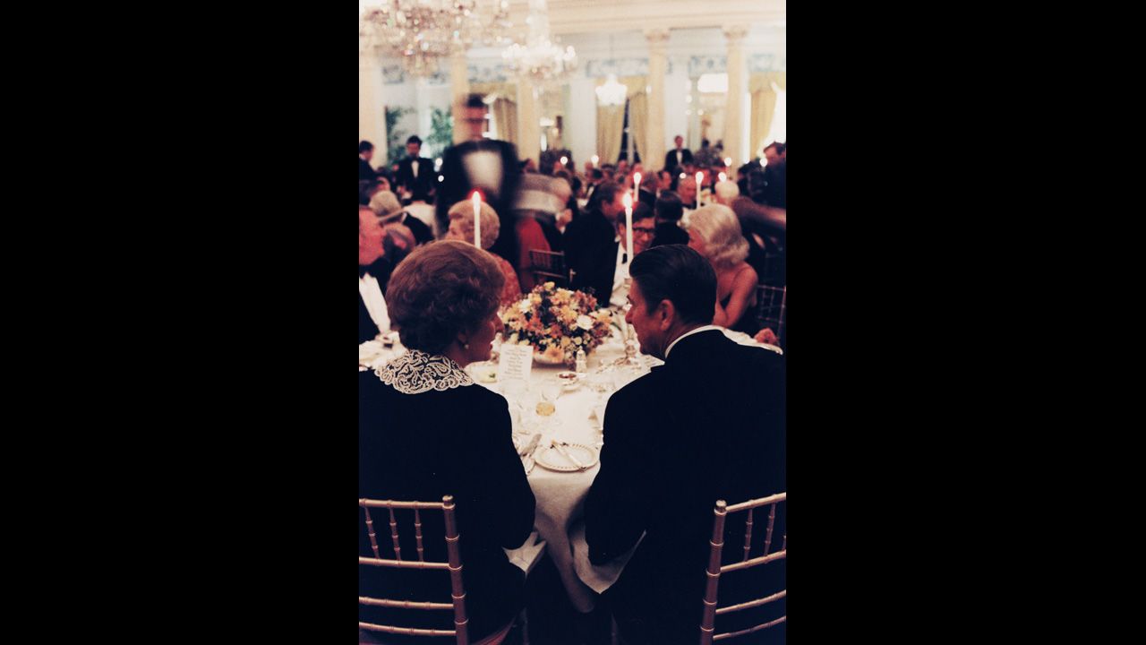Thatcher and Reagan chat at a British Embassy dinner in Washington in February 1981.