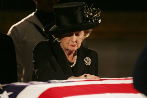 Thatcher pays her respects at Reagan's casket during his viewing at the Capitol in June 2004. 