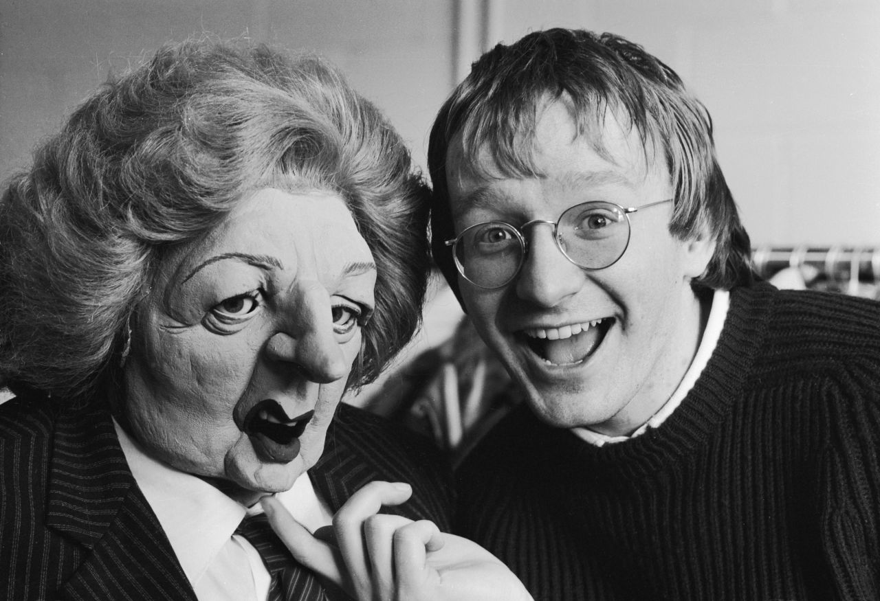 Impressionist Steve Nallon poses in 1985 with a puppet of Thatcher from the satirical TV show "Spitting Image."