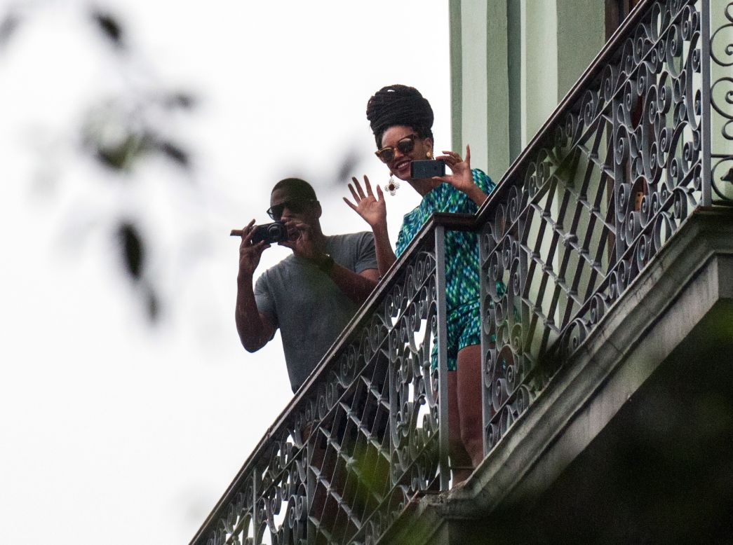 Celebrities Beyonce and Jay-Z look out at the crowd from their balcony at the Saratoga Hotel in Havana on Friday, April 5. The couple were photographed in Havana last week, apparently celebrating their fifth wedding anniversary on the island. <a href="http://politicalticker.blogs.cnn.com/2013/04/06/lawmakers-ask-why-beyonce-and-jay-z-went-to-cuba/">Two Republican lawmakers</a> are asking a government agency to look into a recent trip to Cuba by the couple, suggesting they violated restrictions on travel to the communist island.