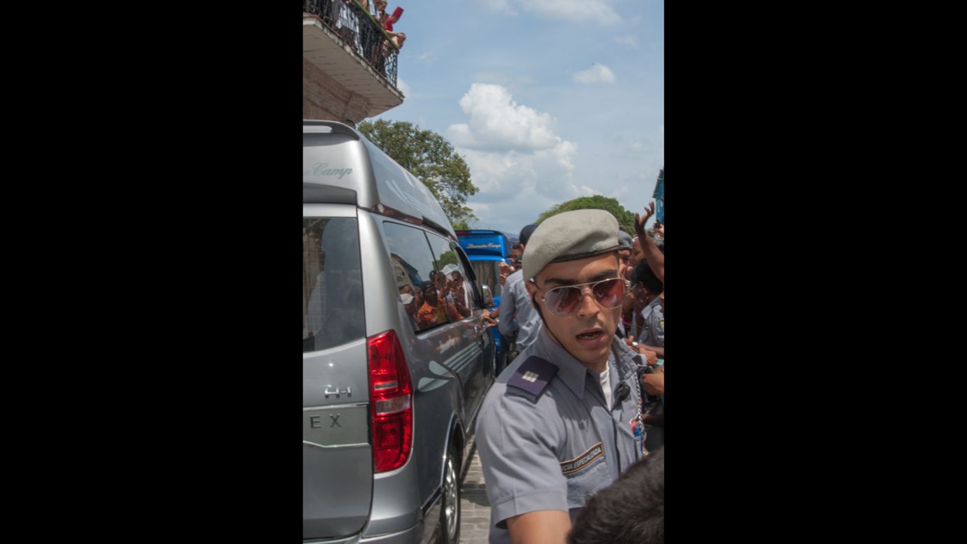 Cuban police block people from reaching the couple on Friday.