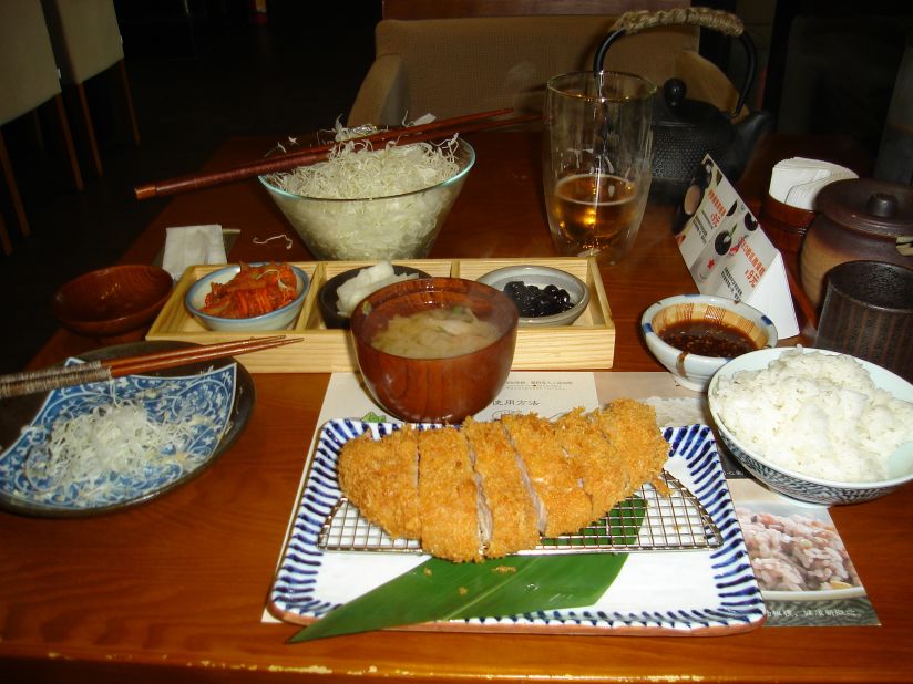 <a href="http://ireport.cnn.com/docs/DOC-944068">Philip Atkinson </a>says he had one of the best Japanese dishes he's ever tasted in China. Tonkatsu is a boneless pork chop that is breaded in panko, deep-fried and served with a seasoned dipping sauce. He says this is his favorite travel dish because of the food and the service. "Preparing food for another person is a very connecting experience when you think about it. That other person is taking the very act of nourishing you," he said.