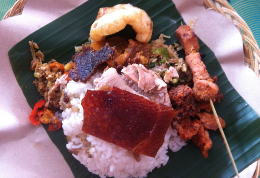 <a href="http://ireport.cnn.com/docs/DOC-948655">Steven Kusuma</a> says he was blown away after trying a pork dish in Bali, Indonesia. The dish was made of a roast pork that was seasoned with local herbs. Babi Guling, or "rolling roast pork," is a traditional meal in Bali. "What makes the rolling roast pork is the way the pig is cooked. It is roasted on an open fire while being rolled continuously by the cook for hours," he said. 