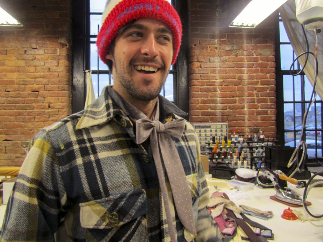 Menswear designer Otis James models a "lady tie" that he created specifically for women.