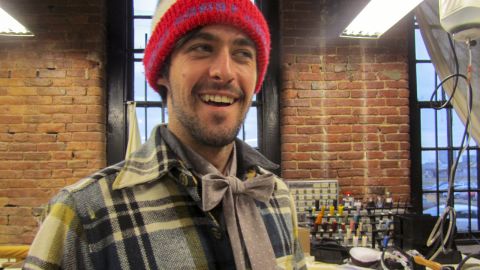 Menswear designer Otis James models a "lady tie" that he created specifically for women.