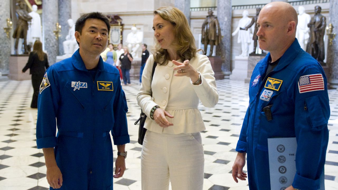 Giffords gives a tour of the US Capitol's Statuary Hall in 2008. Joining her are Japanese astronaut Akihiko Hoshide, left, and her husband, NASA astronaut Mark Kelly. Kelly has since become a US senator.