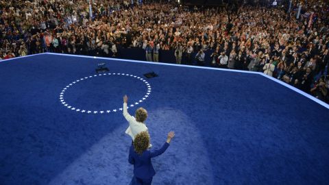 Wasserman Schultz, head of the Democratic National Committee,  and Giffords wave to the audience after Giffords delivered the Pledge of Allegiance on September 6, 2012, the final day of the Democratic National Convention in Charlotte, North Carolina.