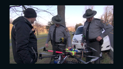 Officers inspect a drone launched by animal rights group SHARK after it was shot down in November in Pennsylvania.