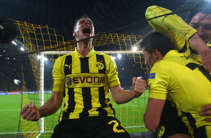 Lukasz Piszczek, Nuri Sahin and Mats Hummels can't help but go crazy with excitement following the final whistle.