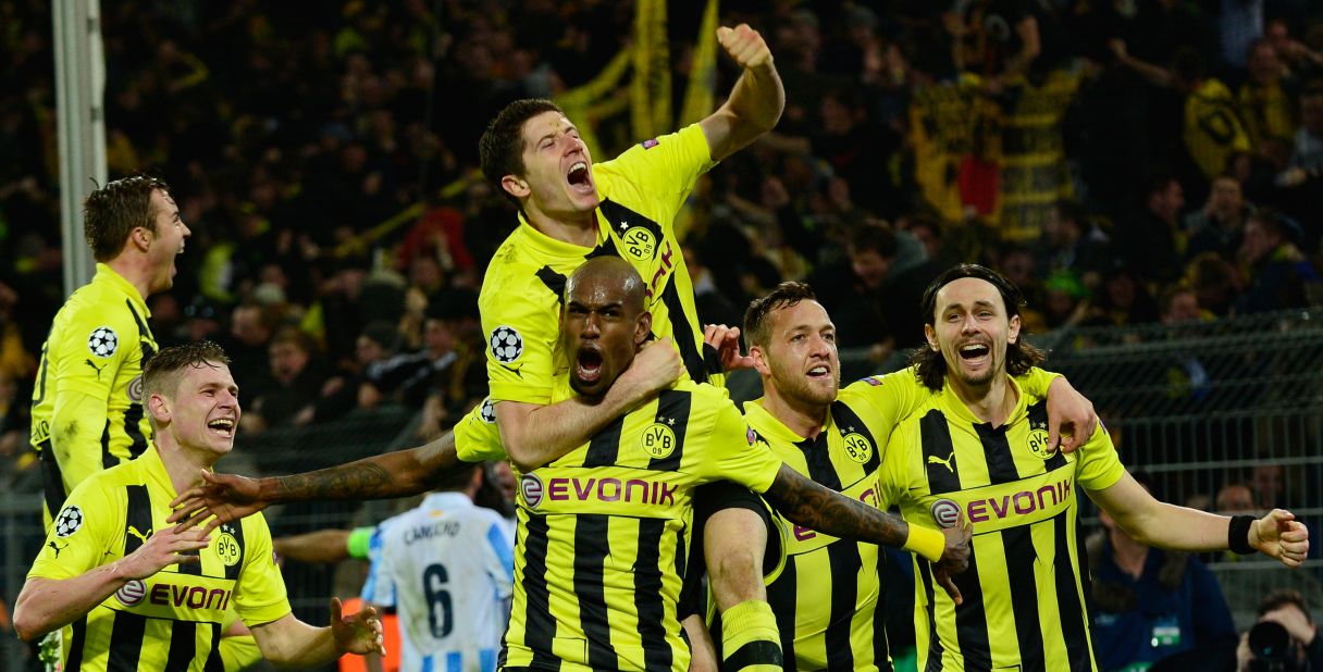 Dortmund's players celebrate their famous 3-2 victory over Malaga and will now look forward to the semifinals where it could be joined by fellow German club Bayern Munich.