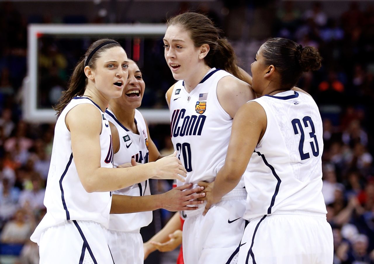 Breanna Stewart of UCONN celebrates with teammates after a play in the first half against Louisville during the title game on April 9.