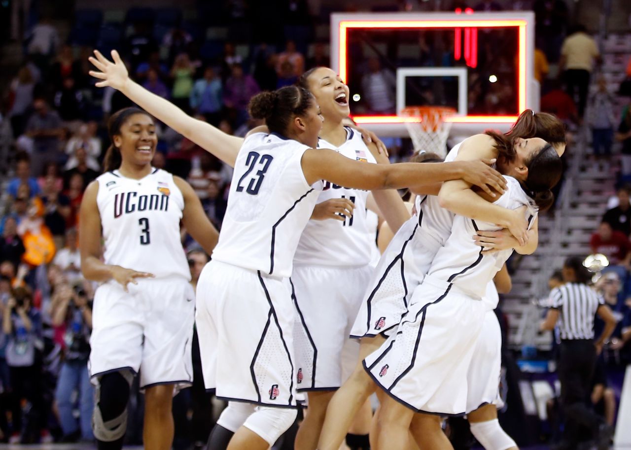 Connecticut Huskies players celebrate after defeating the Louisville Cardinals 93-60 during the NCAA Women's Championship at New Orleans Arena on April 9.