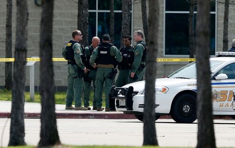 Harris County sheriff's officers seal off the campus after at least 14 people were injured in a stabbing incident at the CyFair campus of Lone Star College in Cypress, Texas, on Tuesday, April 9. The community college in northwest Houston was on lockdown and police detained student Dylan Quick, 20. 