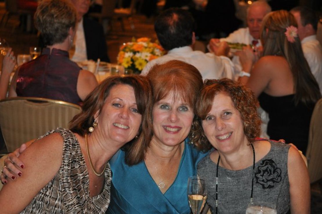 Sisters Mary Scherlach, center, Jane Dougherty, right, and Sue at Mary's daughter's 2010  wedding. 