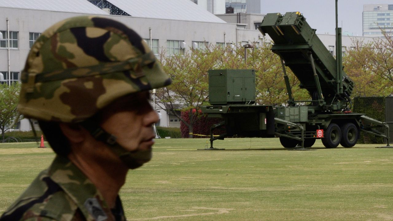 A Japanese soldier is on alert as Patriot Advanced Capability-3 missile launchers are deployed at the Defense Ministry in Tokyo on Wednesday, April 10.