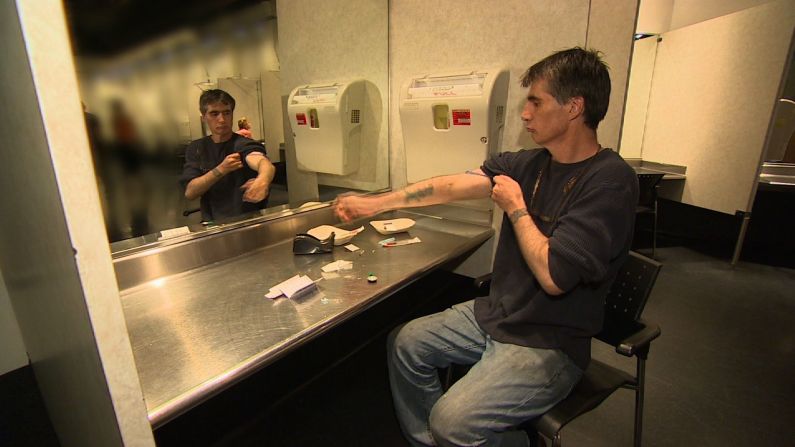 Insite is a supervised drug injection center in Vancouver, Canada. Pictured, Steve, a long-term heroin addict, prepares to inject himself.