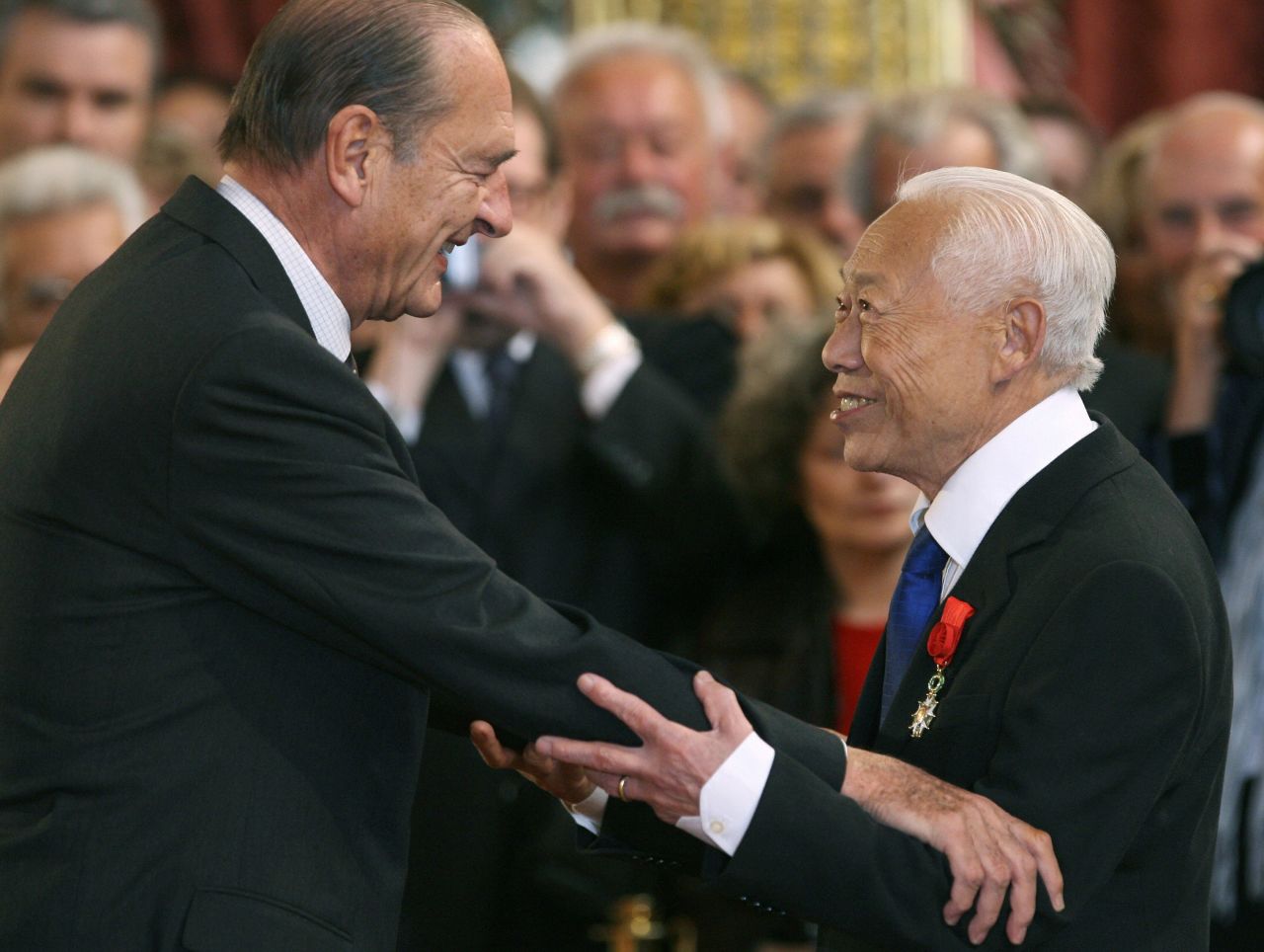 French President Jacques Chirac (L) gives the insignia of the 'Grand Officier de la Legion d'honneur' (Legion of Honor) to Zao Wou-ki at the Elysee Palace in Paris in November 2006. 