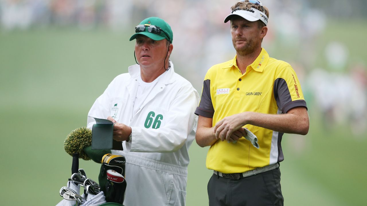 David Lynn of England, right, stands next to his caddie Wayne Hussellbury at the first hole.