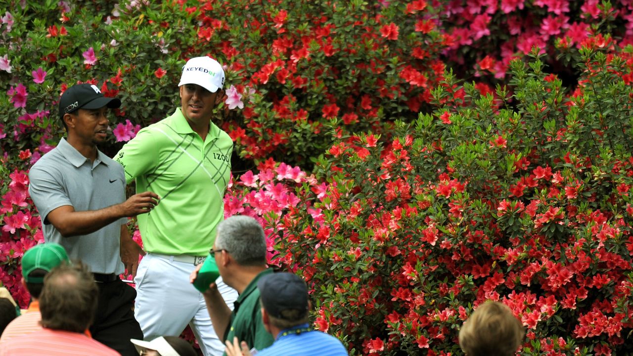Tiger Woods and Scott Piercy of the U.S. walk together during the first round.