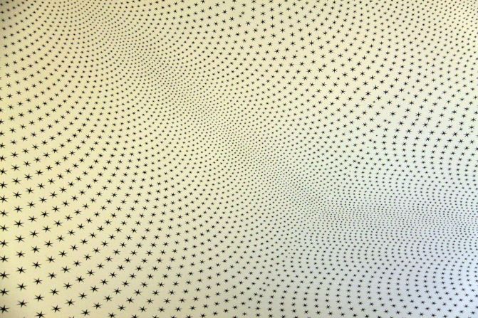 Turner Prize-winning British artist Richard Wright was commissioned to create a new installation, featuring more than 47,000 black stars, in dizzying patterns on the ceilings of the rooms to the sides of "The Night Watch".