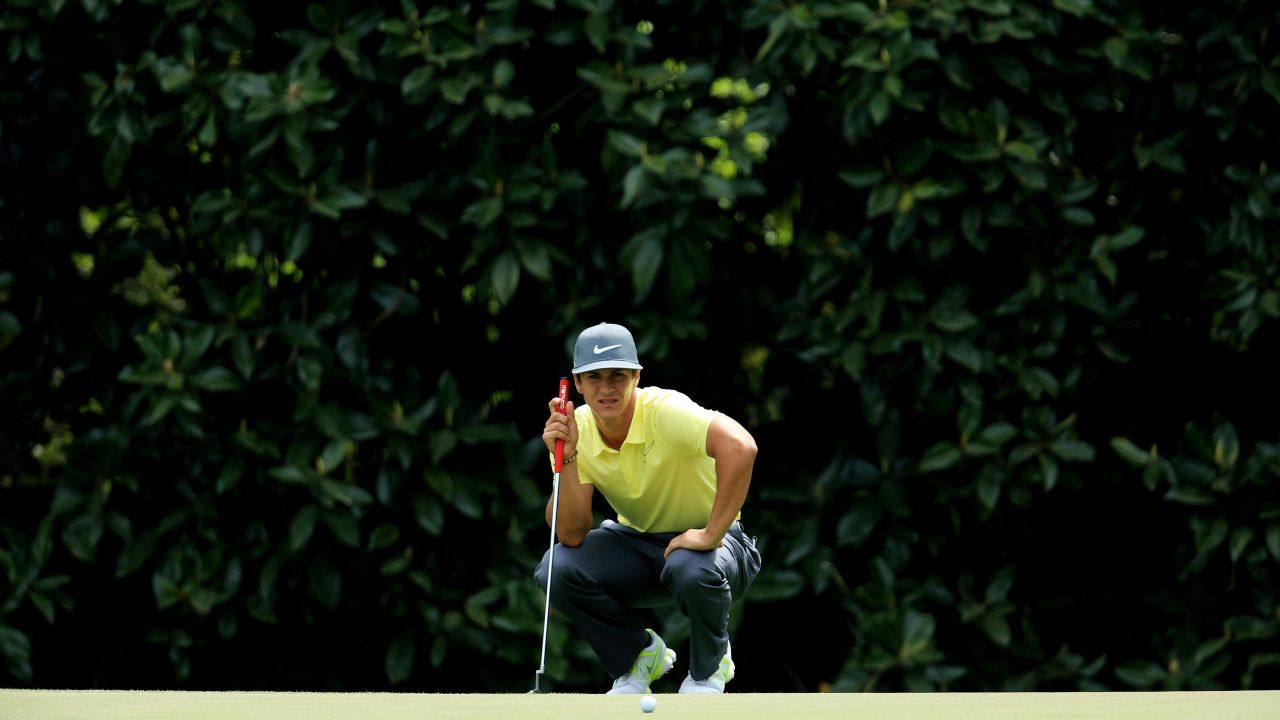 Thorbjorn Olesen of Denmark lines up a putt on the fifth hole.