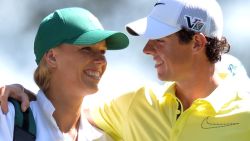 Rory McIlroy of Northern Ireland and his girlfriend tennis star Caroline Wozniacki speak as they play in the Par 3 Contest at the 77th Masters golf tournament at Augusta National Golf Club on April 10, 2013 in Augusta, Georgia. Tournament competition begins April 11. AFP PHOTO / JIM WATSON (Photo credit should read JIM WATSON/AFP/Getty Images