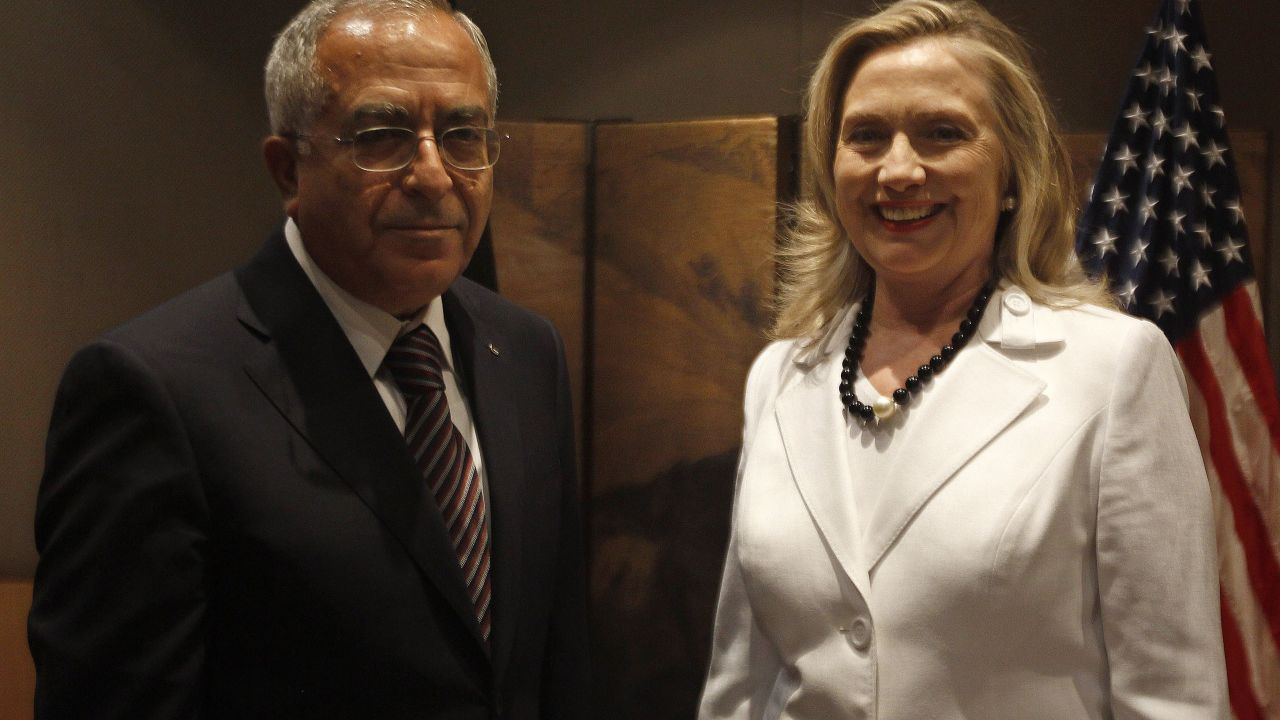 Palestinian Prime Minister Salam Fayyad and former U.S. Secretary of State Hillary Clinton in Jerusalem in July 2012.