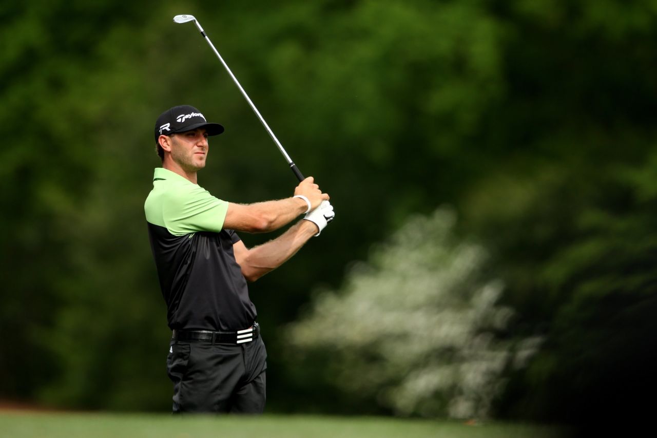 Dustin Johnson of the U.S. watches his tee shot on the 12th hole during the first round of the 2013 Masters Tournament on Thursday, April 11, at  Augusta National Golf Club in Georgia. Click through to see all the shots from the first day and <a href="http://www.cnn.com/2013/04/10/golf/gallery/masters-par-3/index.html" target="_blank">look back at the Par 3 Contest</a>.