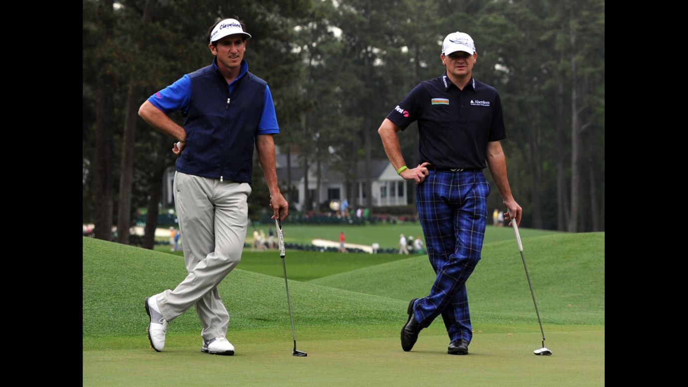Gonzalo Fernandez-Castano of Spain and Paul Lawrie of Scotland during the second round on April 12.