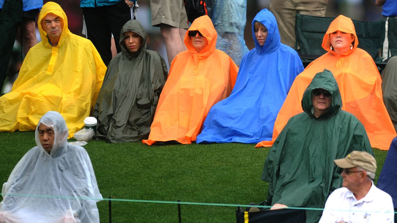Fans watch play in the rain.