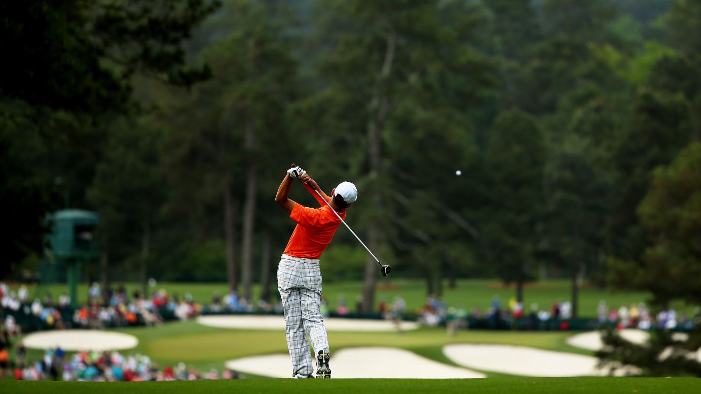 Guan Tianlang of China hits a shot from the second fairway.