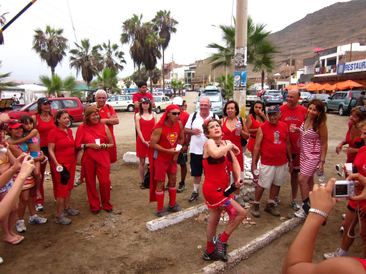 Newcomers are introduced at a Red Dress Run in Peru. The Red Dress charity runs are a hashing tradition.